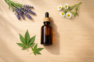 Flat lay with green leaves and wellness items on a light background