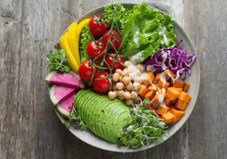 Colorful vegan salad bowl with fresh vegetables