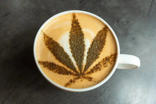 Cup of coffee with latte art on a wooden table