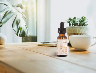 Bottle of CBD tincture on a table